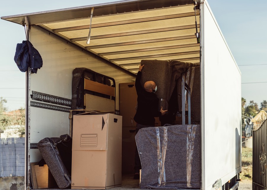 Movers loading a truck in Lafayette, Louisiana