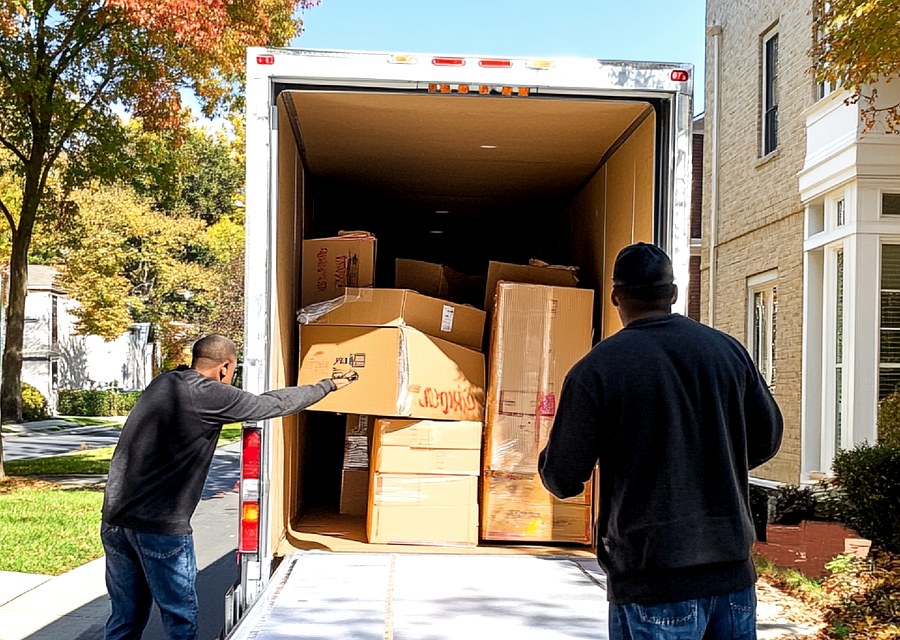 Movers loading a truck in Lafayette, Louisiana